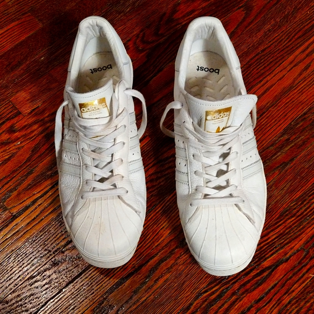 Men's white on white Adidas boost sneakers.